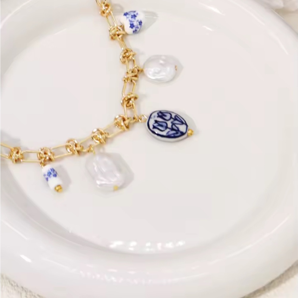 New Anthropologe Gold and Blue Charm Necklace
